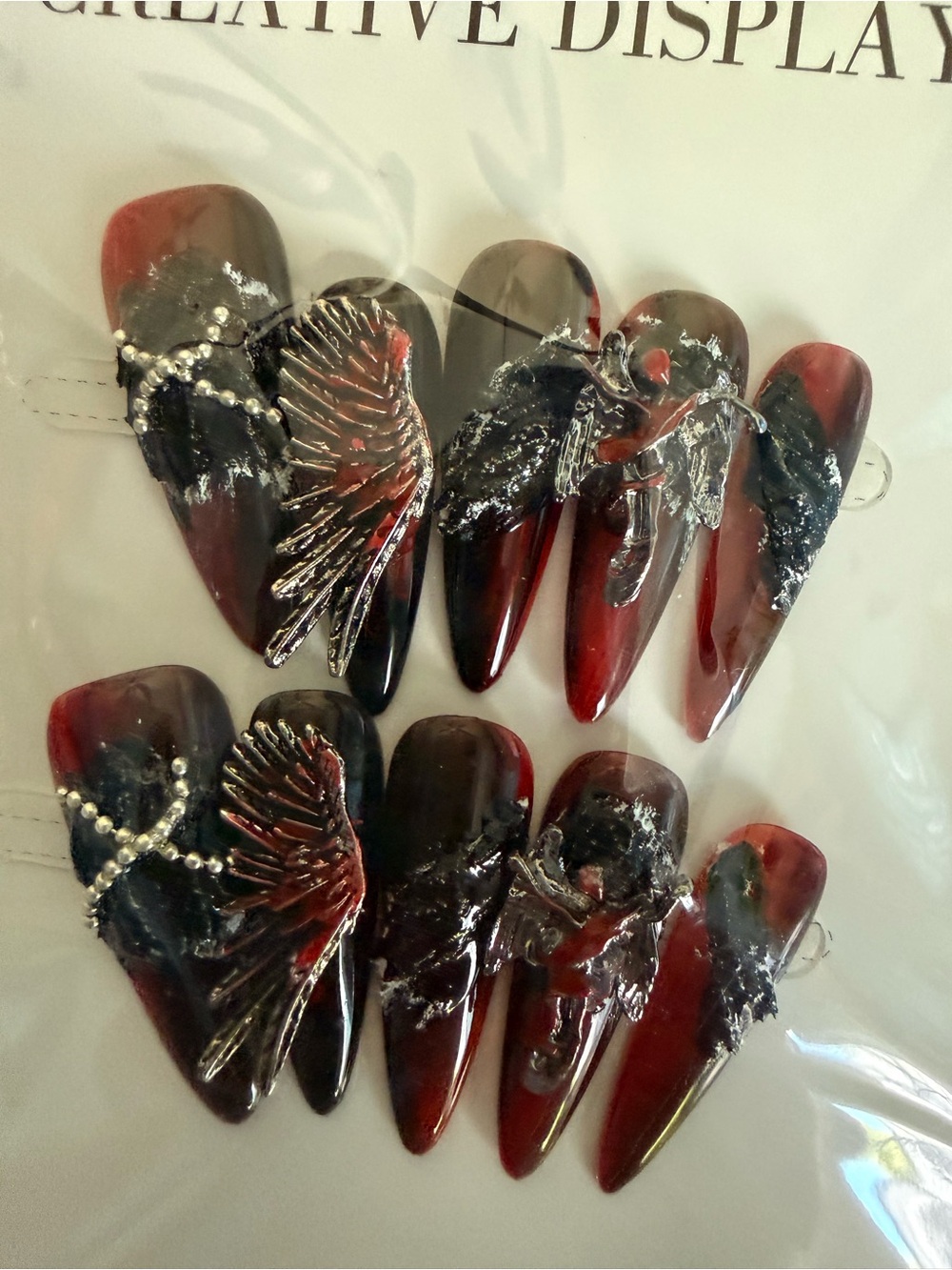 Handmade Long Stiletto Press-On Nails in Deep Red and Black with Wing Charms